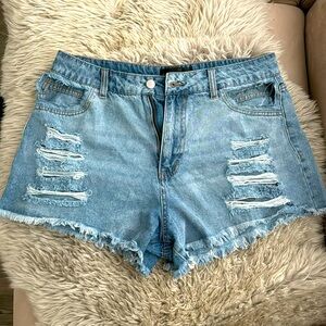 Light blue denim shorts with cutouts